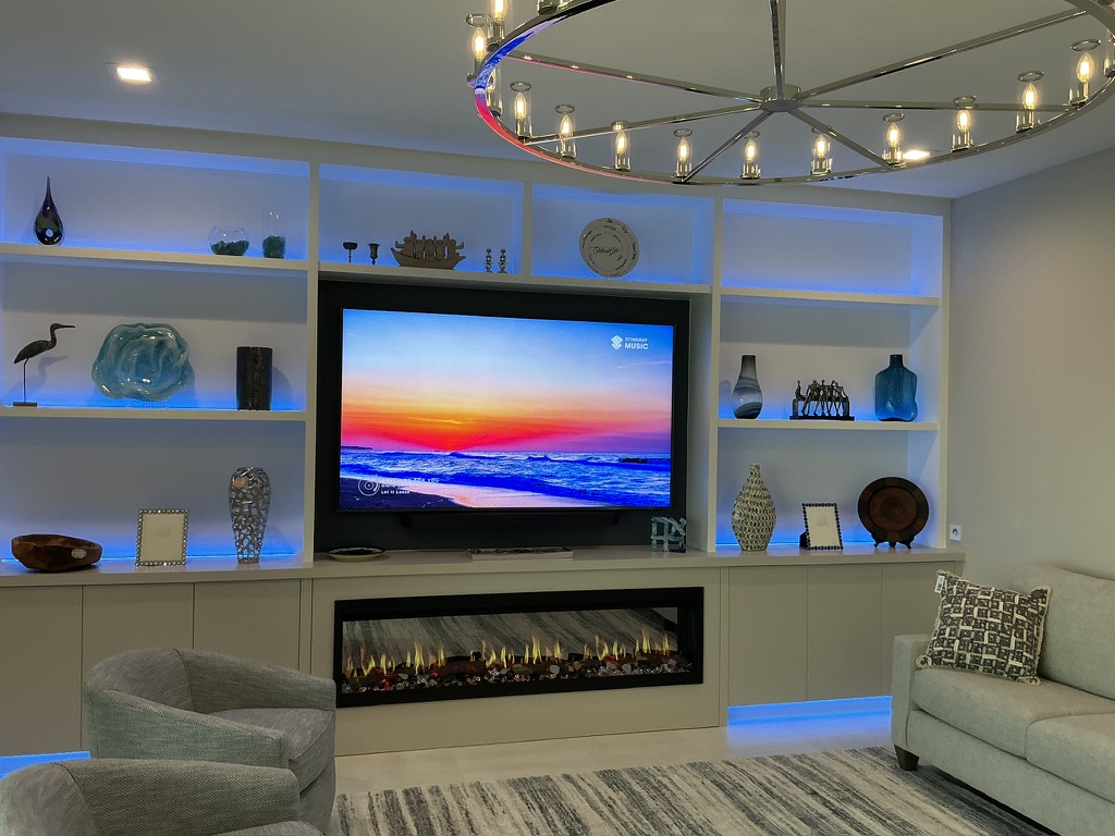 Custom built-in shelving and fireplace wall