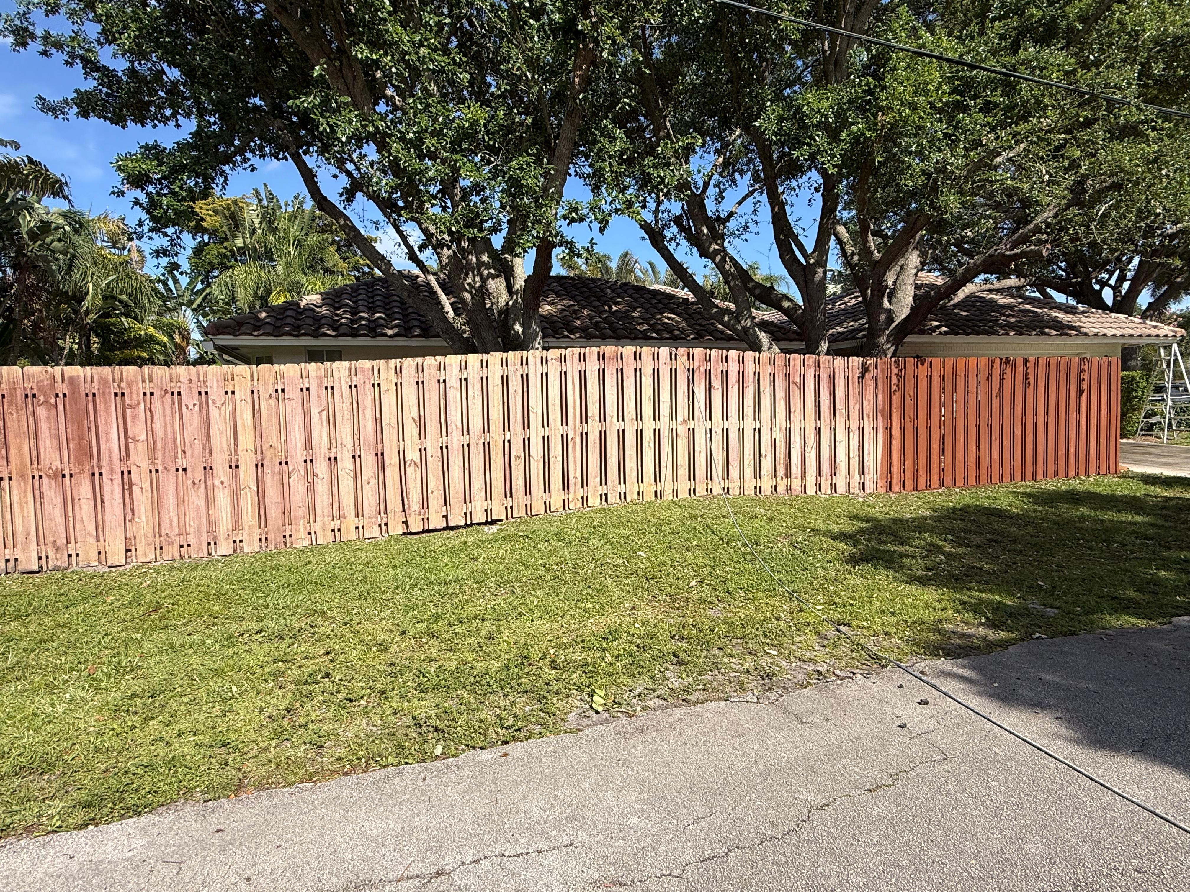 Wood staining fence before and after